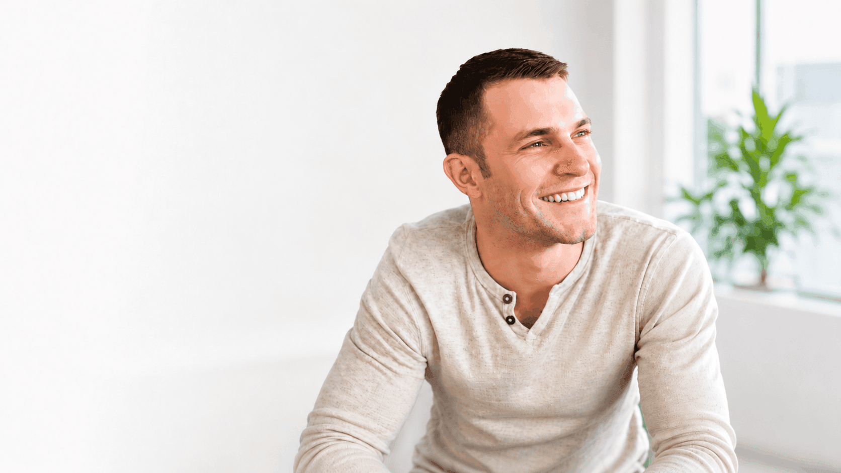 Smiling patient maintaining healthy gums with Perio Max+